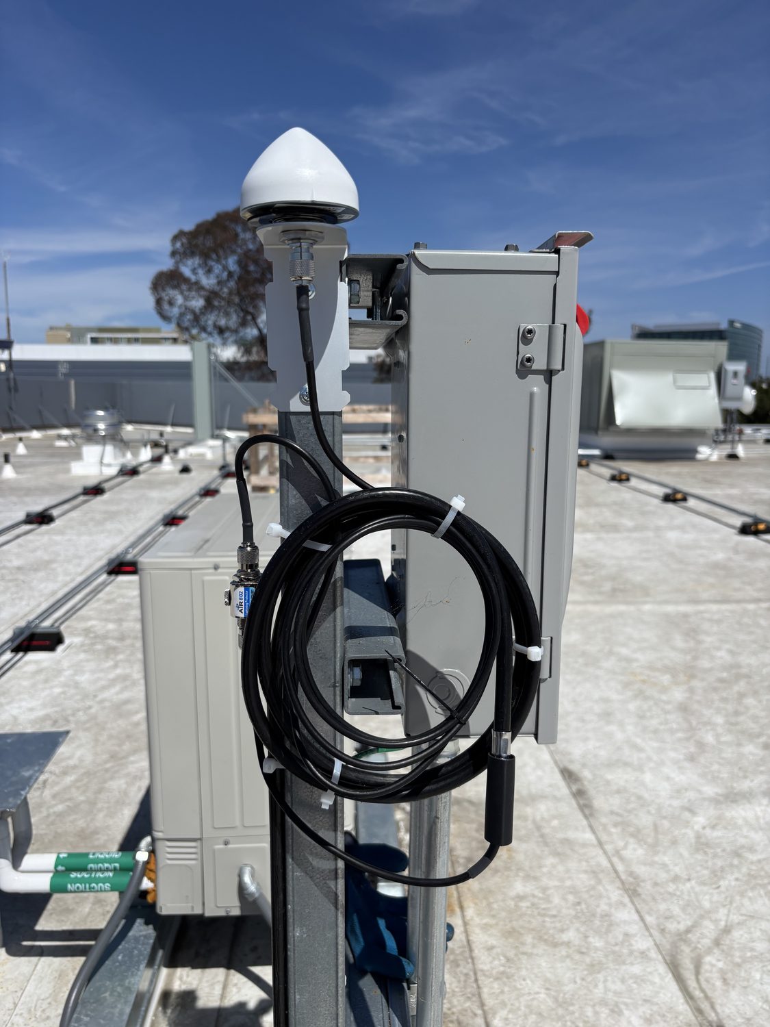 Rooftop antenna, cable, and enclosure installation